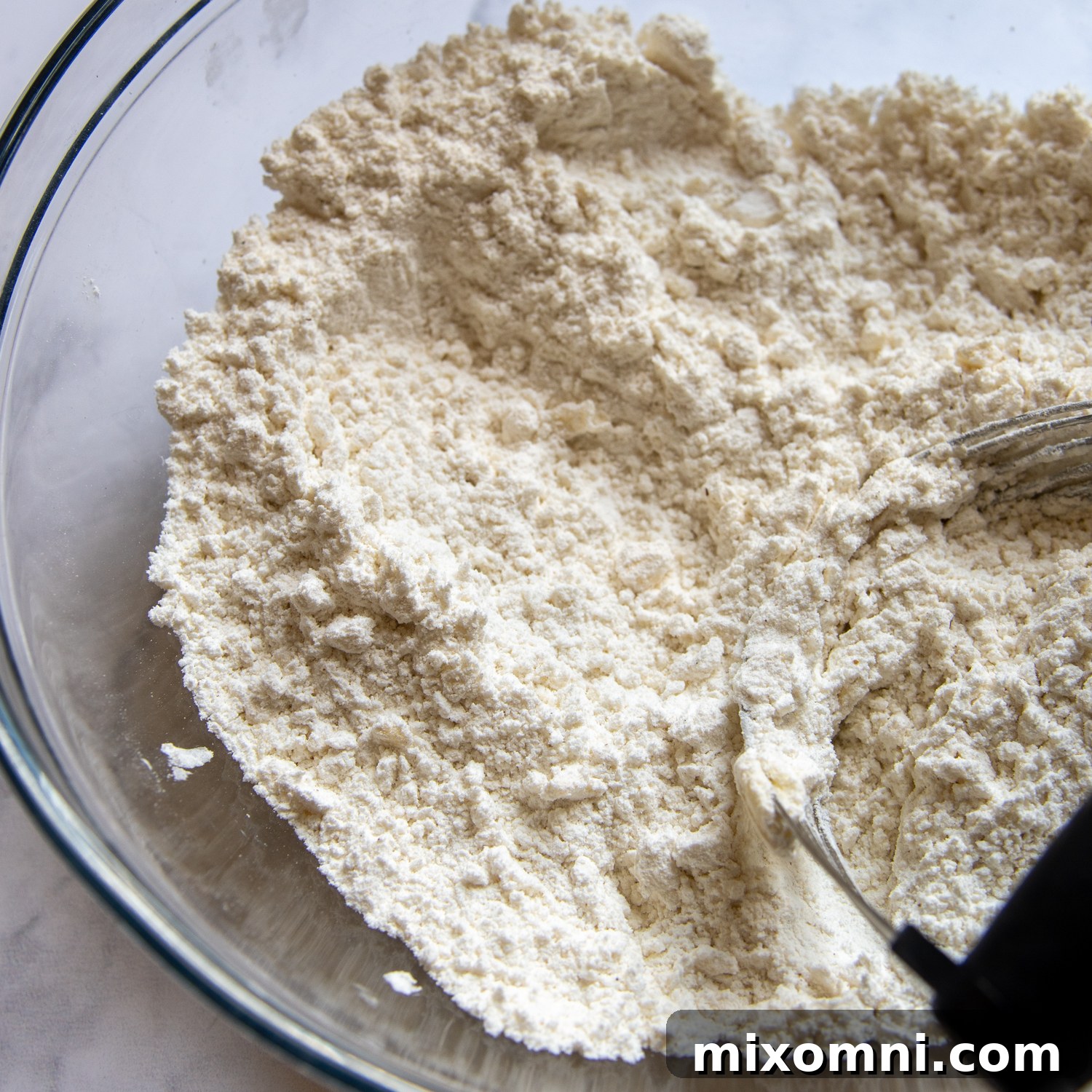 a pastry blender cutting in the butter.