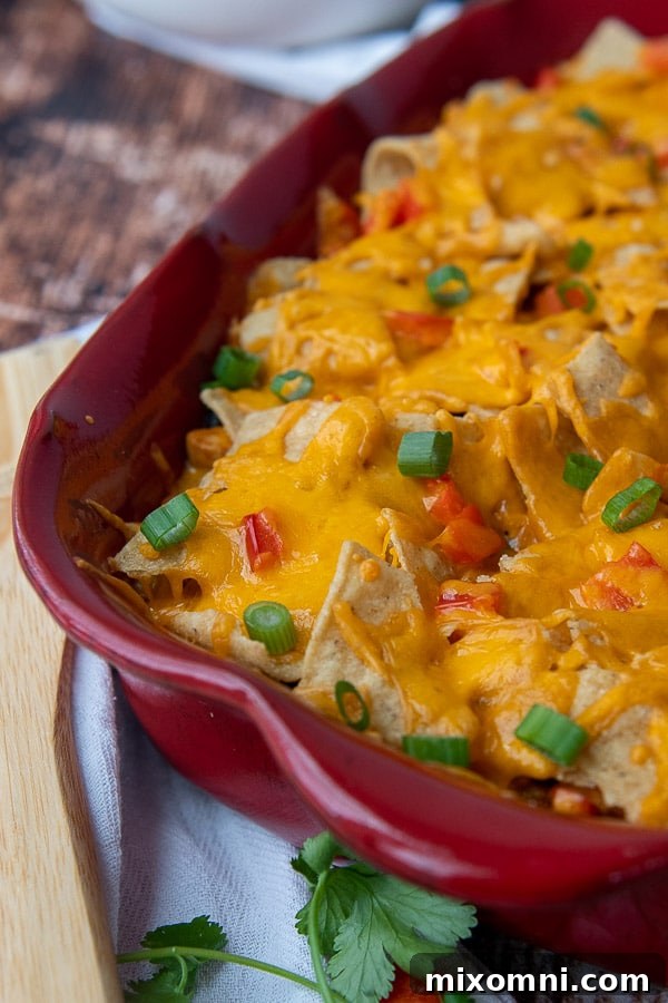 a close up of mexican chicken casserole with melted cheese on top