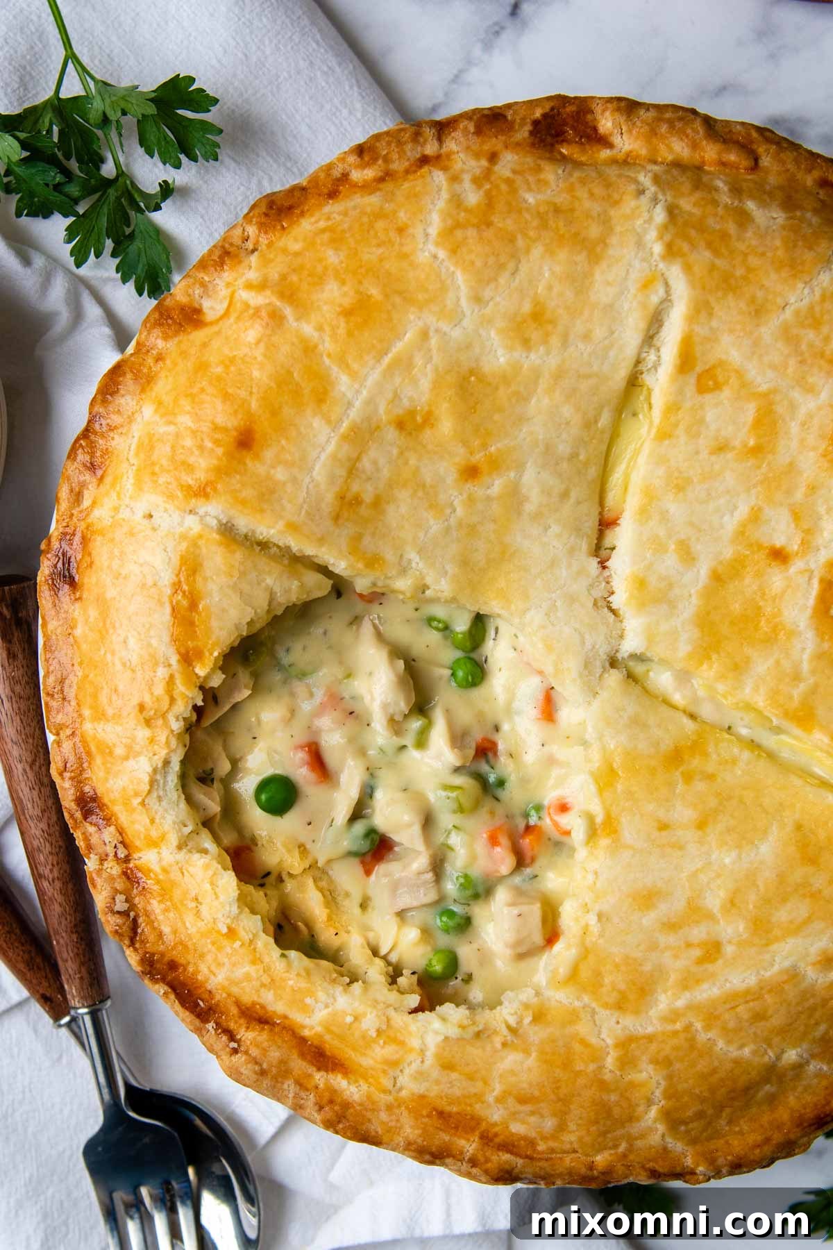 overhead shot of gluten-free pot pie with an opening showing filling