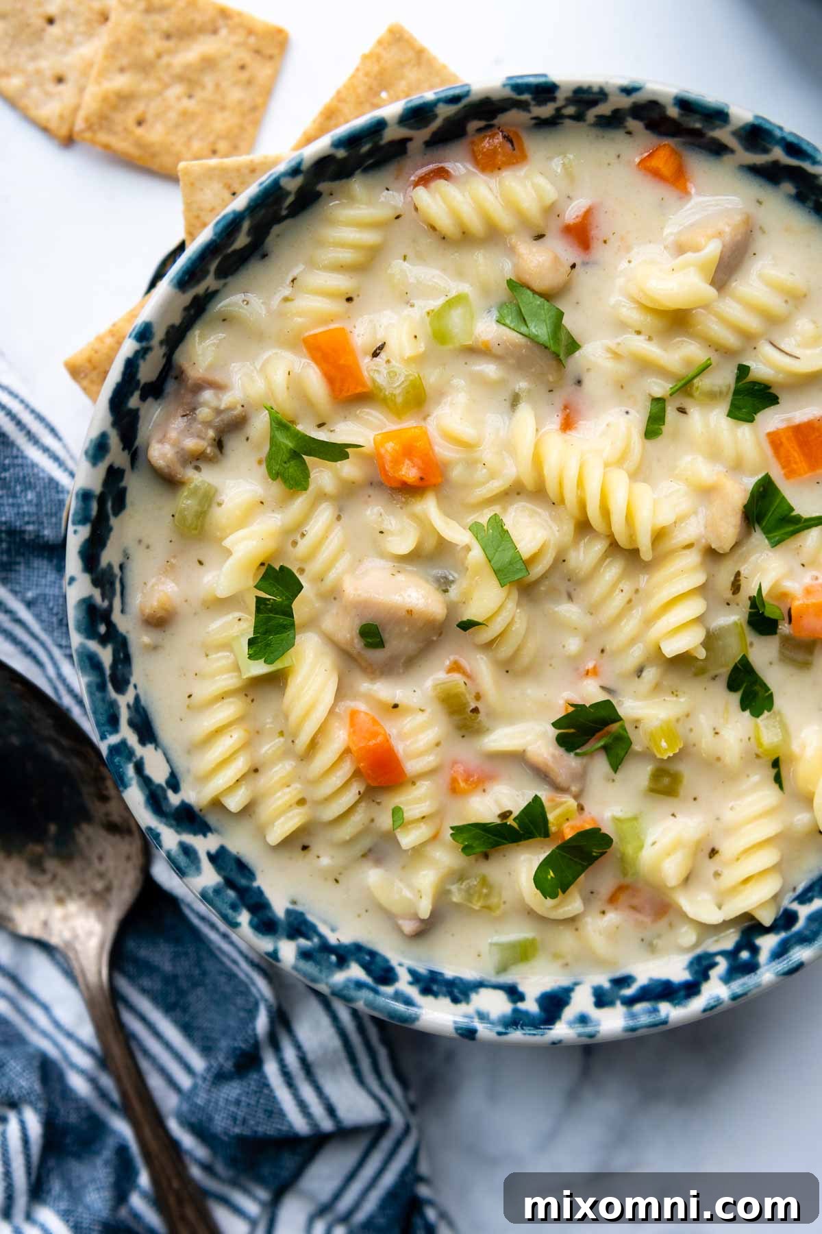 overhead shot of soup in a blue bowl.