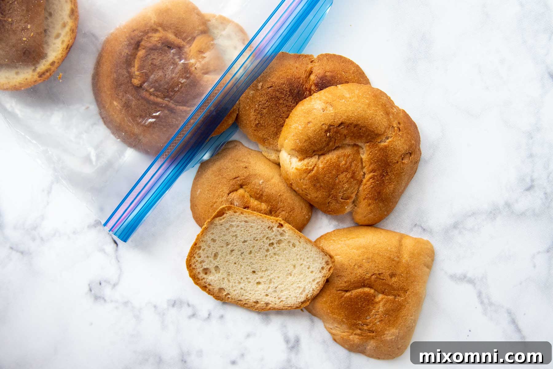 A ziplock bag filled with various gluten-free bread heels and crusts, showing how to collect scraps for homemade breadcrumbs.