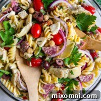 Overhead shot of gluten-free pasta salad in a glass bowl, prepared and ready to serve.