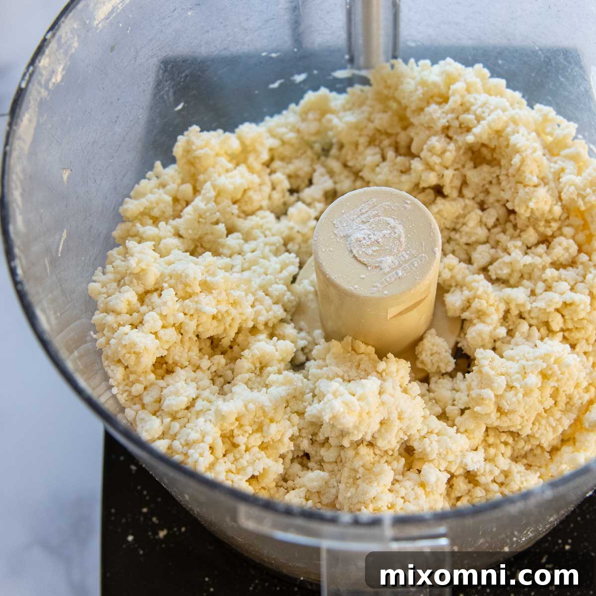 the gluten free pie dough mixed together in a food processor.