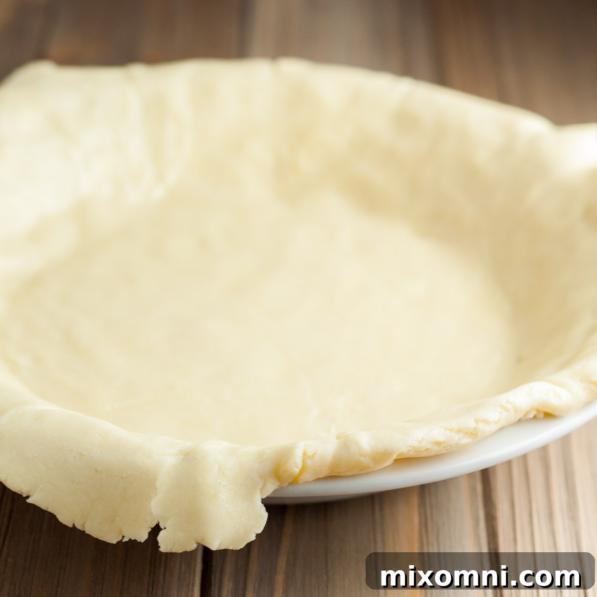 edges folded over in a pie plate.