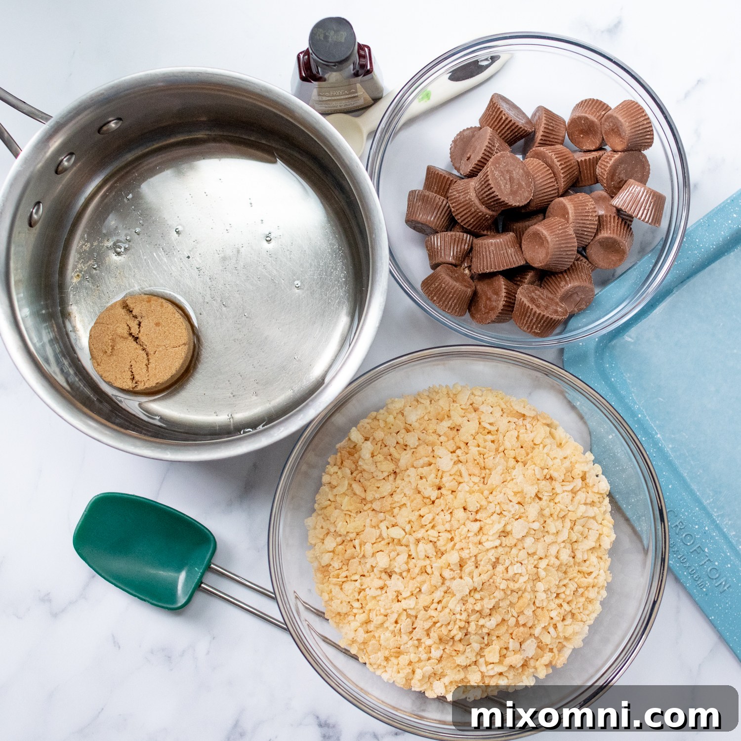 All the necessary ingredients neatly laid out on a kitchen counter, ready for making no-bake spider cookies.