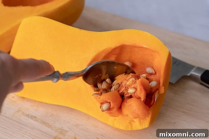 pictures showing how to cut a butternut squash step 1