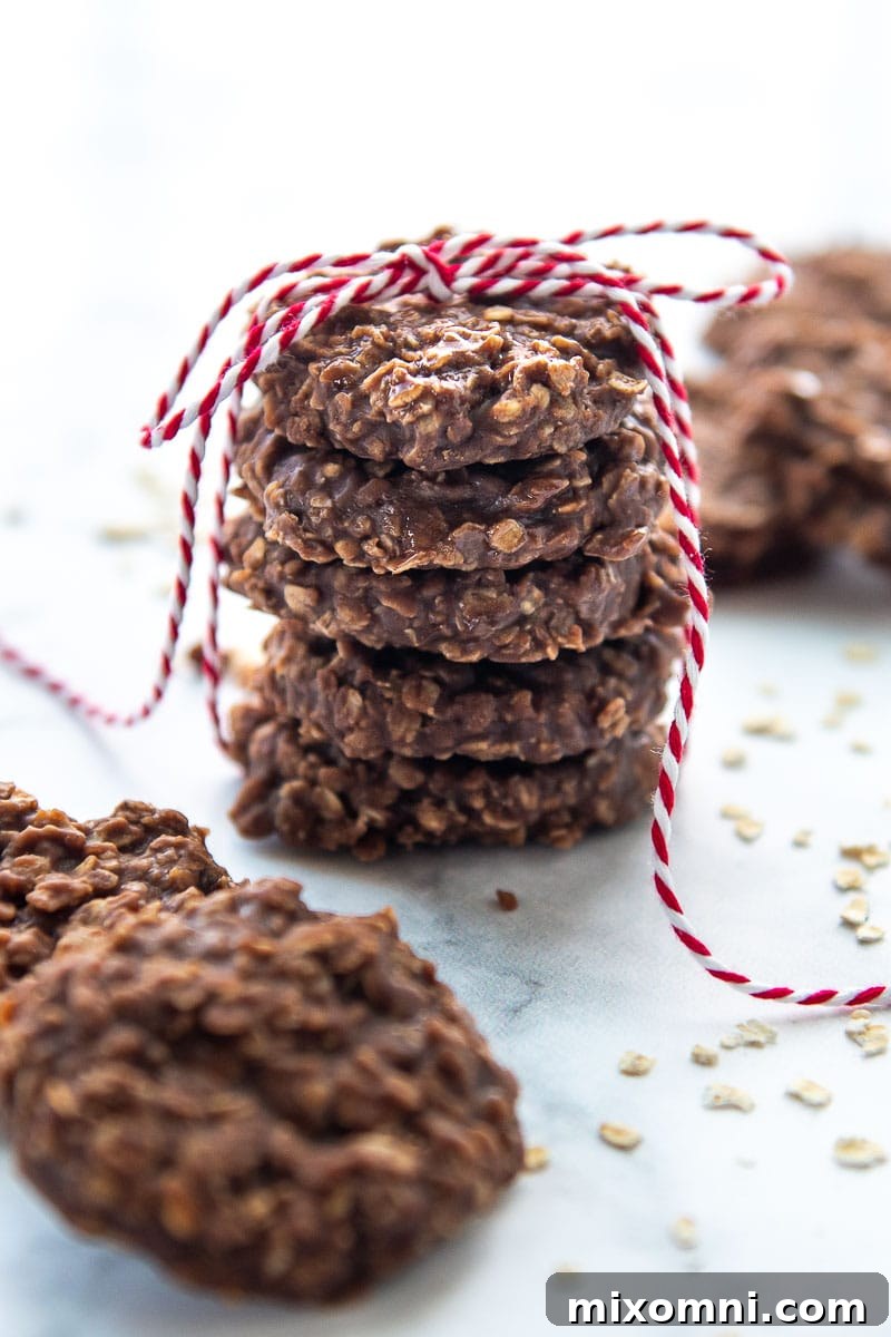 A stack of no-bake Preacher Cookies tied with a red string, highlighting their rustic charm.