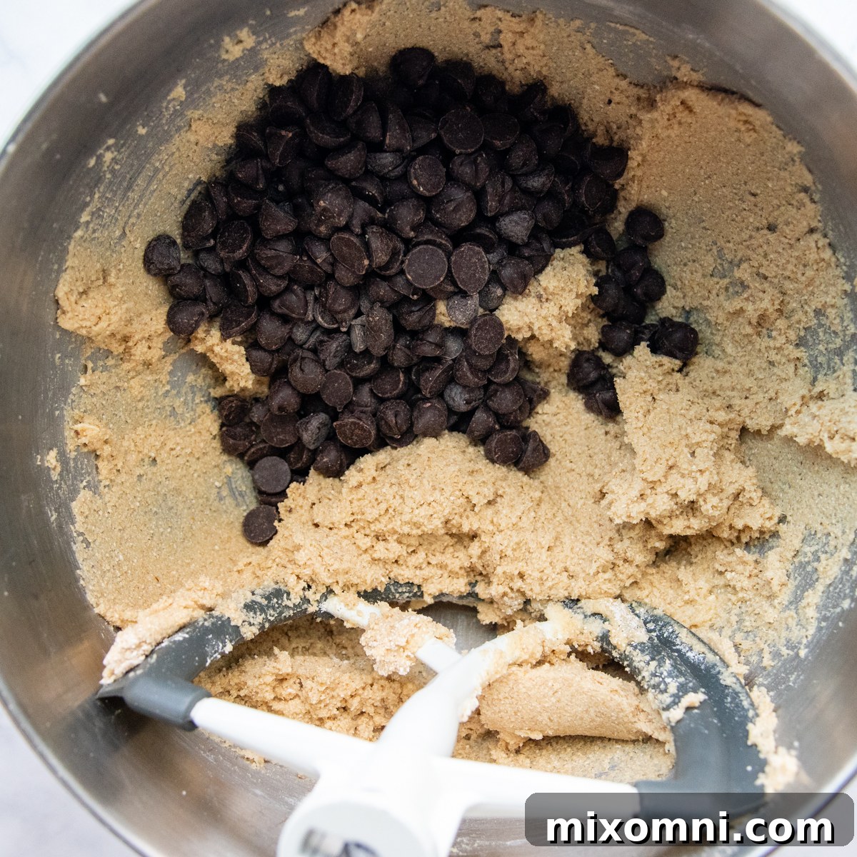Chocolate chips folded into the prepared oat flour cookie dough.
