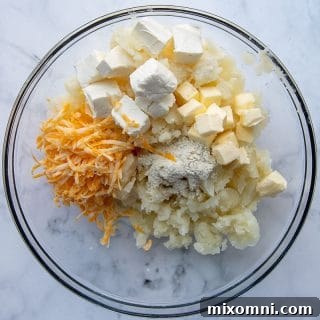 A bowl containing the mashed potato filling, perfectly blended with ranch seasoning, butter, cream cheese, and cheese.