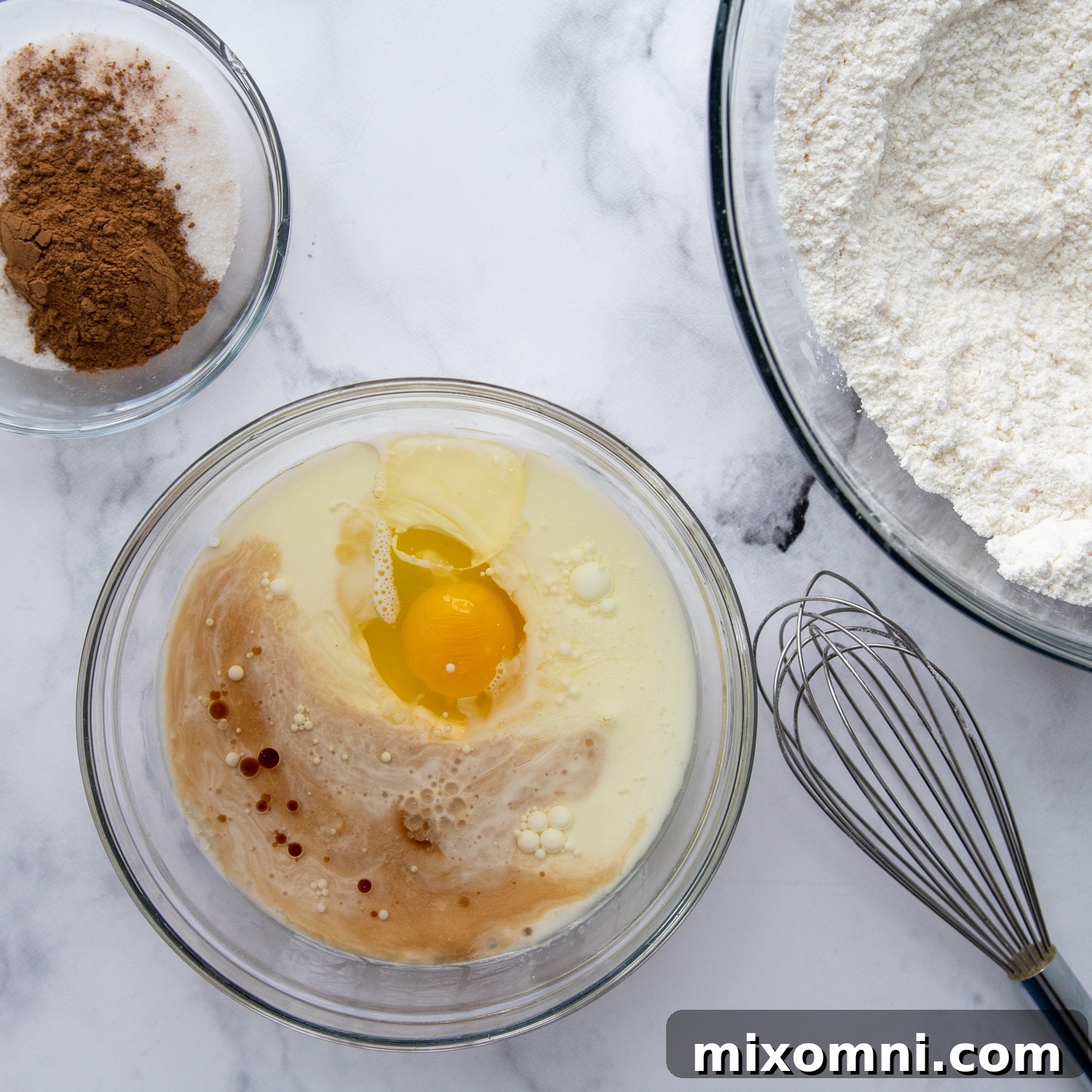 The individual ingredients for the gluten-free cinnamon bread dough laid out in bowls.