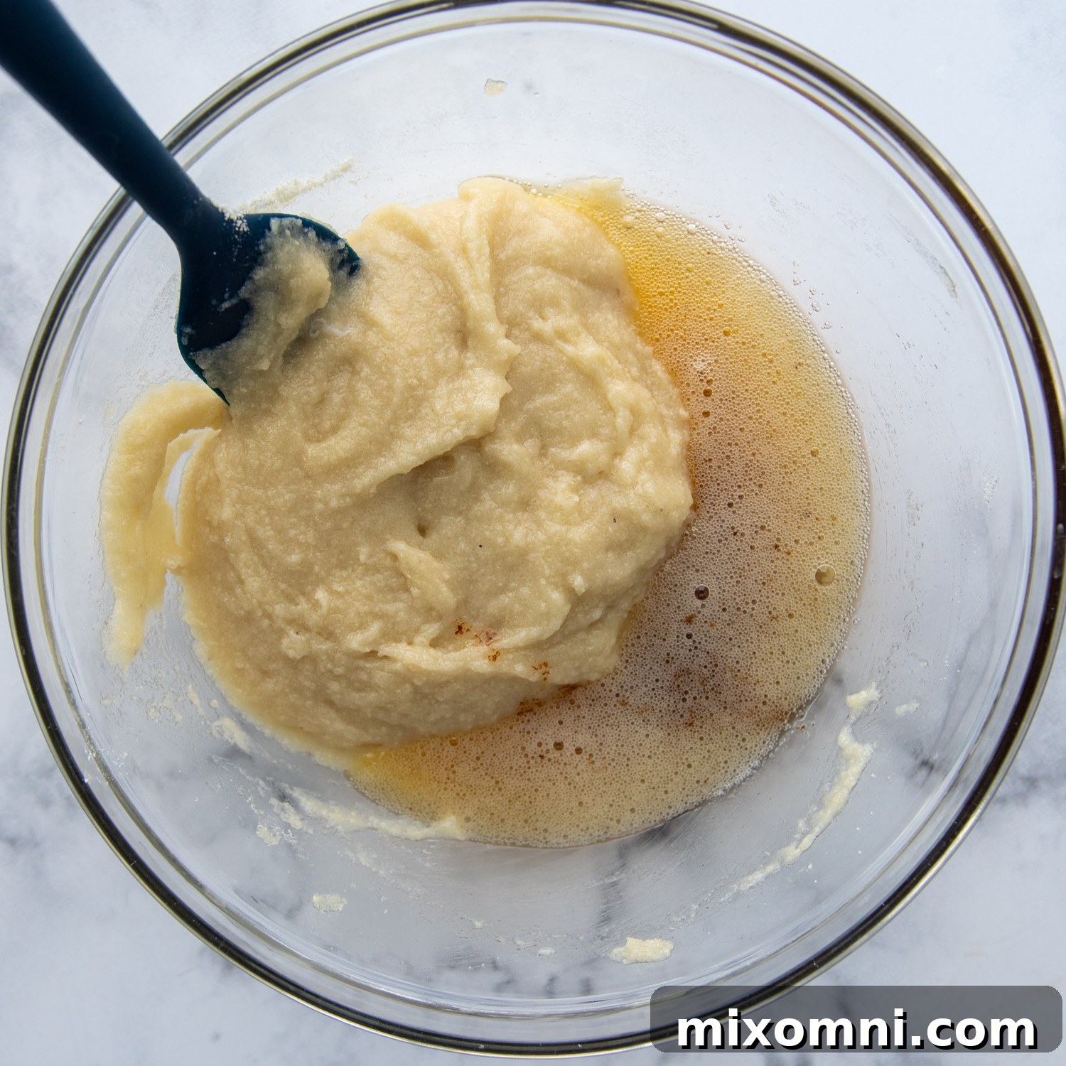 the ingredients for the mini cakes in a glass bowl.