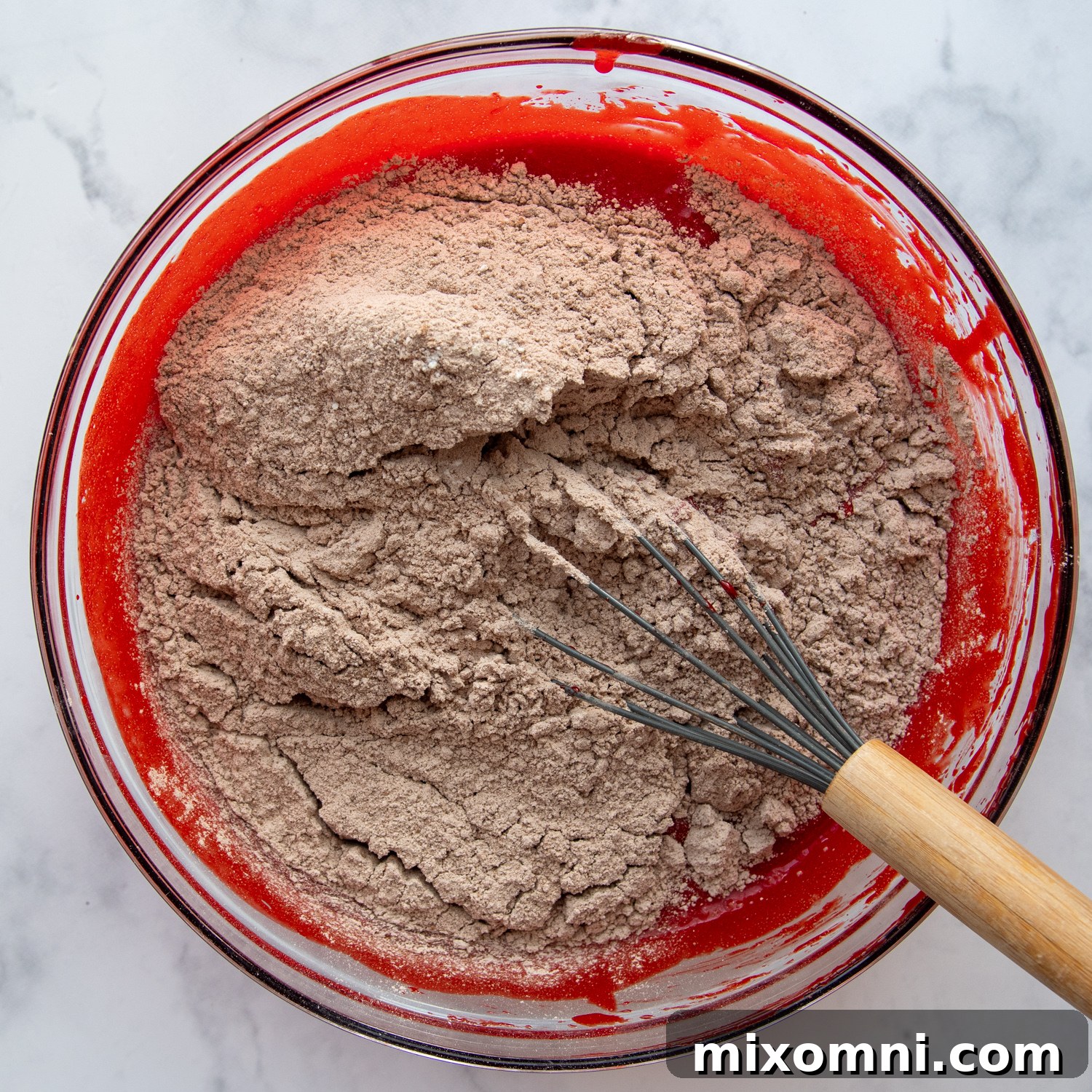 dry ingredients being whisked in.