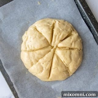 challah sliced in a star pattern before baking