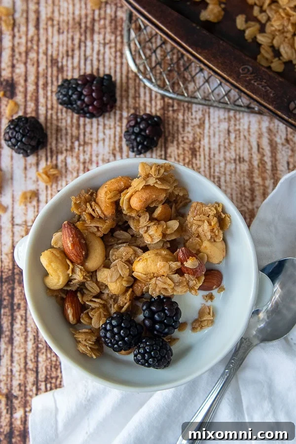A beautiful bowl of homemade gluten-free granola with fresh milk and vibrant berries, showcasing perfect clusters