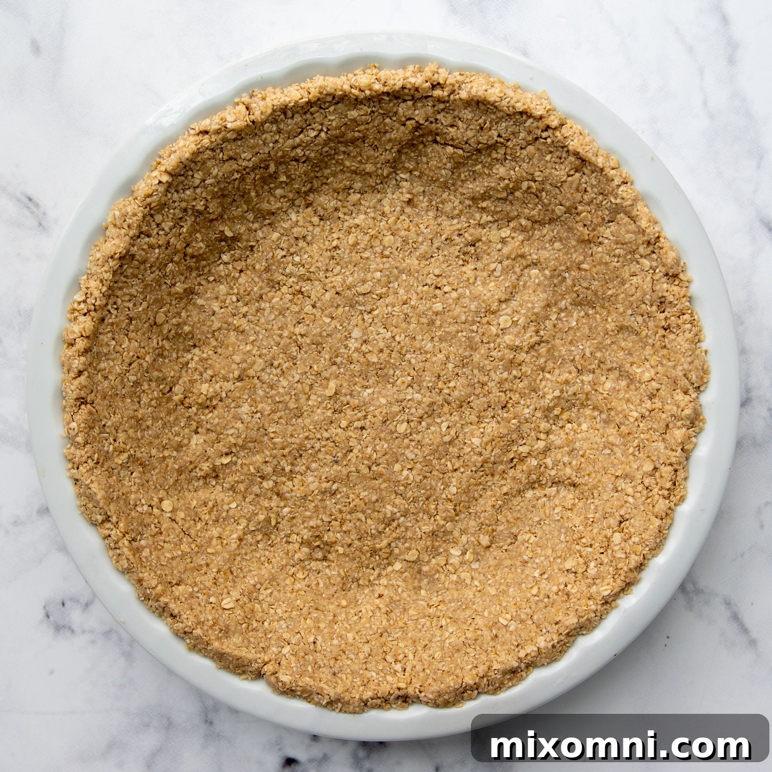 the oatmeal crust pressed into a pie plate.