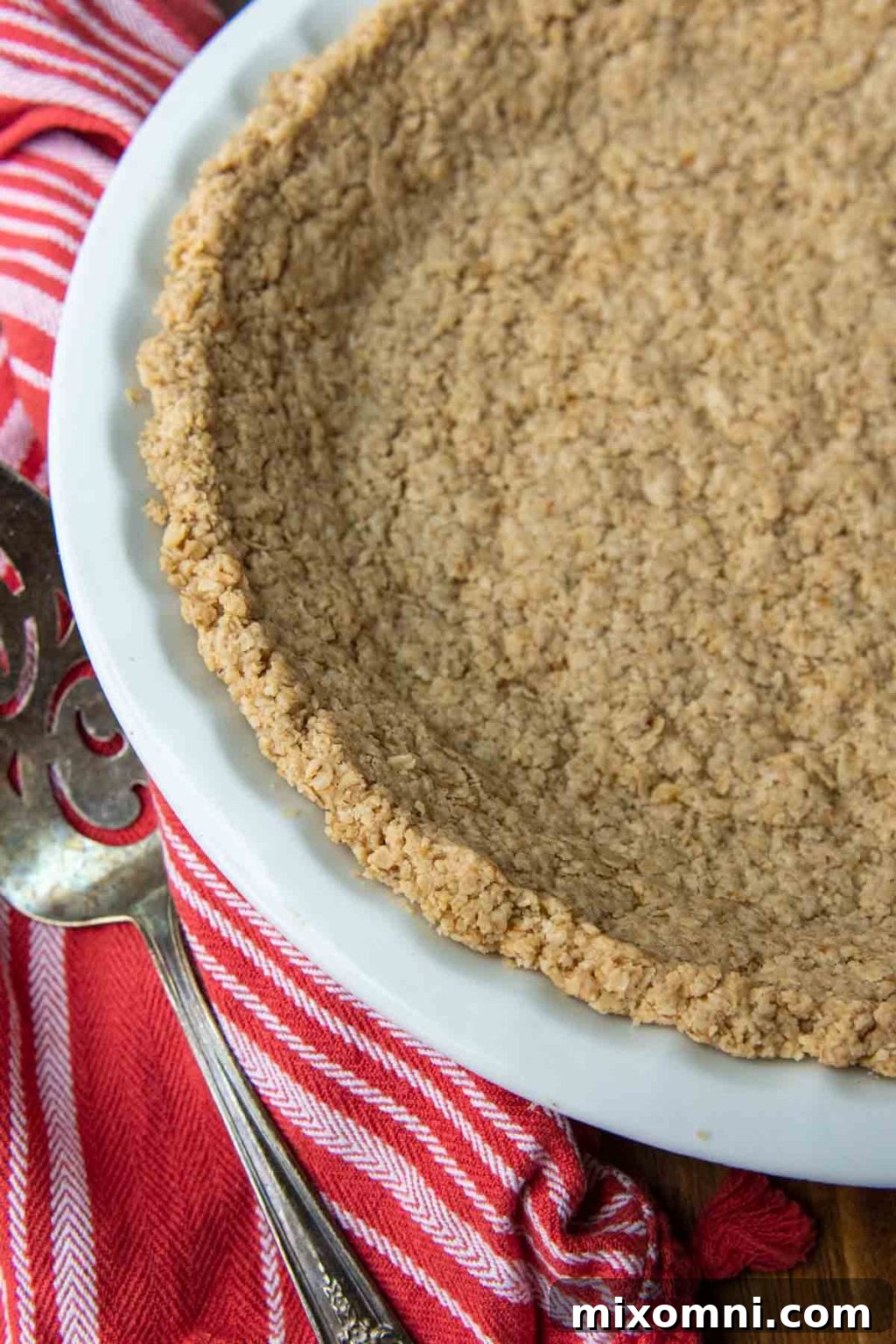 overhead shot of a whole oatmeal crust pie with fresh berries.