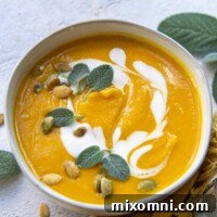 butternut squash soup swirled with coconut milk and fresh sage leaves