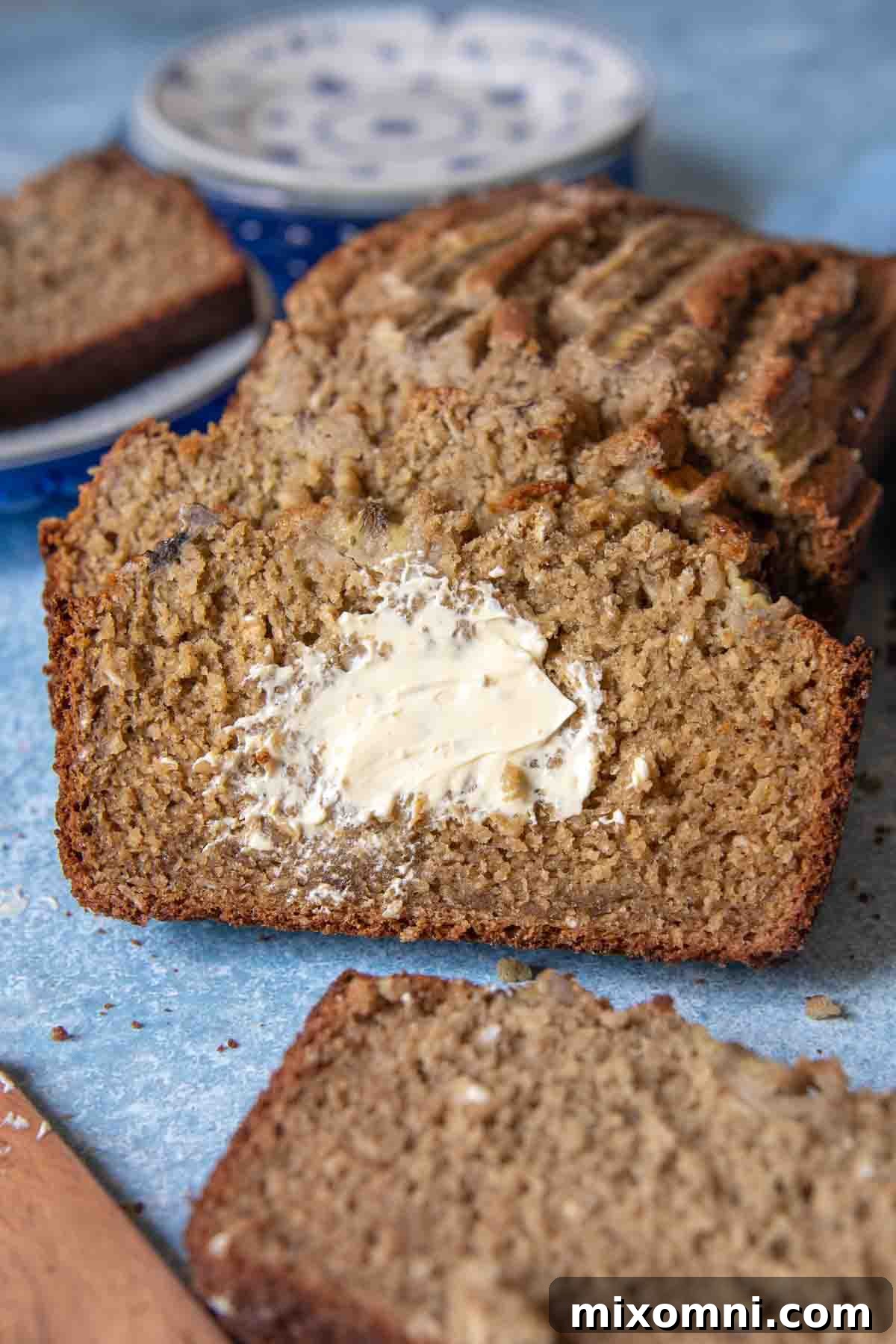 a slice of bread with melted butter spread on