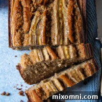 overhead shot of oat flour banana bread on a blue background