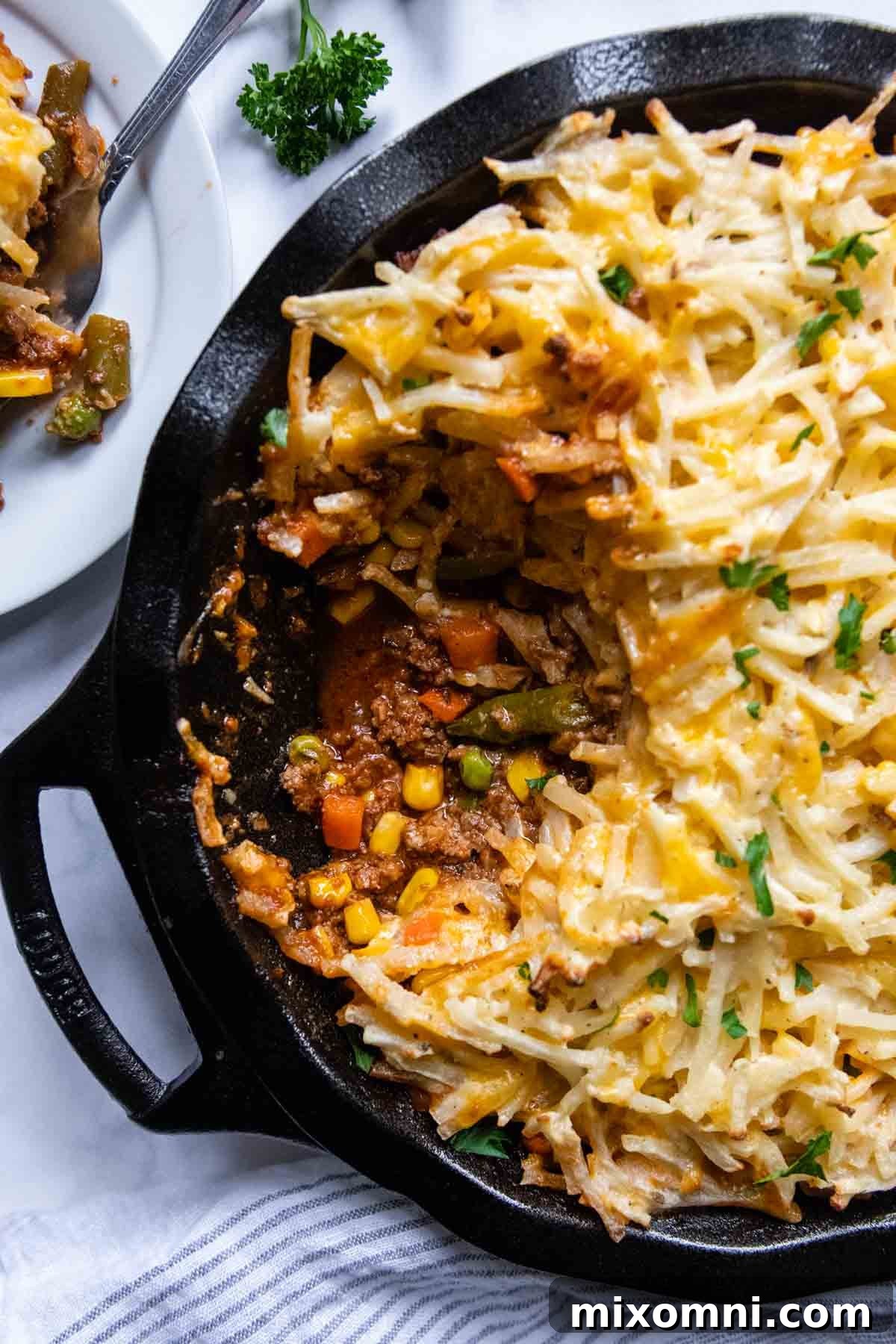 overhead shot of shepherds pie with a scoop taken out.
