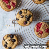 overhead shot of oat flour muffins on a circular cooling rack