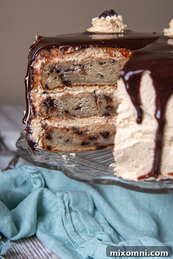 A beautiful peanut butter banana cake on a cake stand, with a slice removed to reveal its moist layers and creamy frosting.