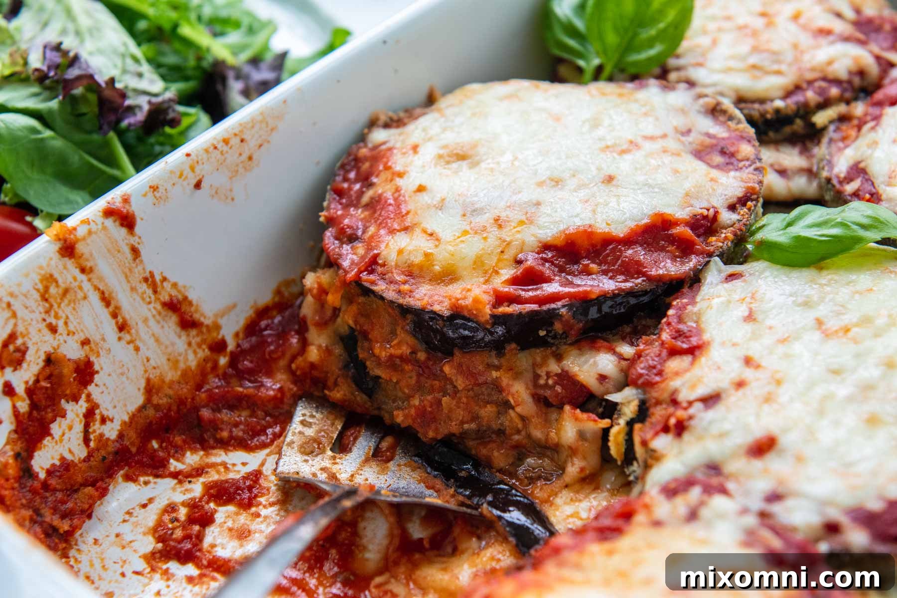 close up of eggplant cut in a baking dish