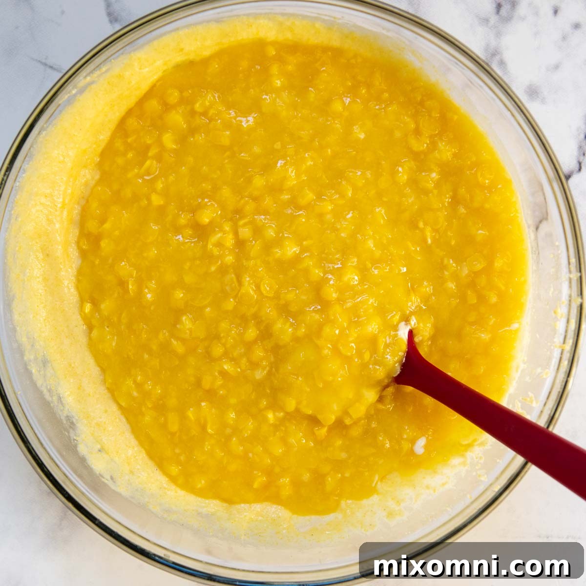 The smooth gluten-free corn casserole batter in a large mixing bowl, ready for the baking dish