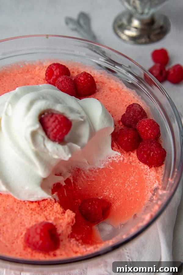 a scoop of jello salad taken out a serving bowl