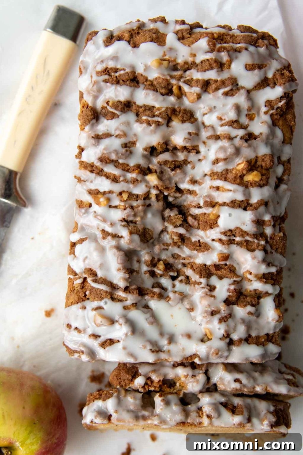 overhead shot of gluten free apple bread with glaze drizzled over top