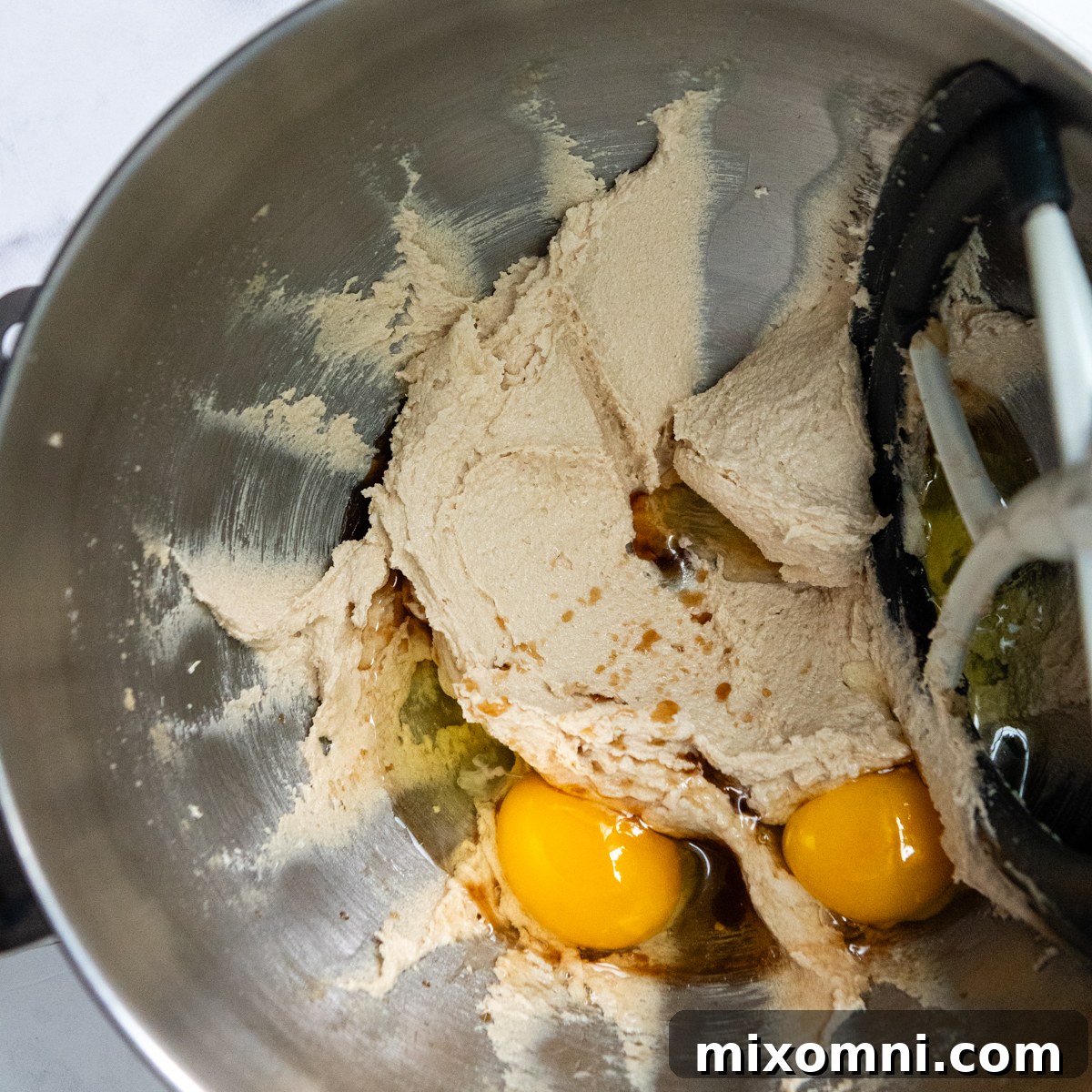 batter with eggs and vanilla about to be beaten in.