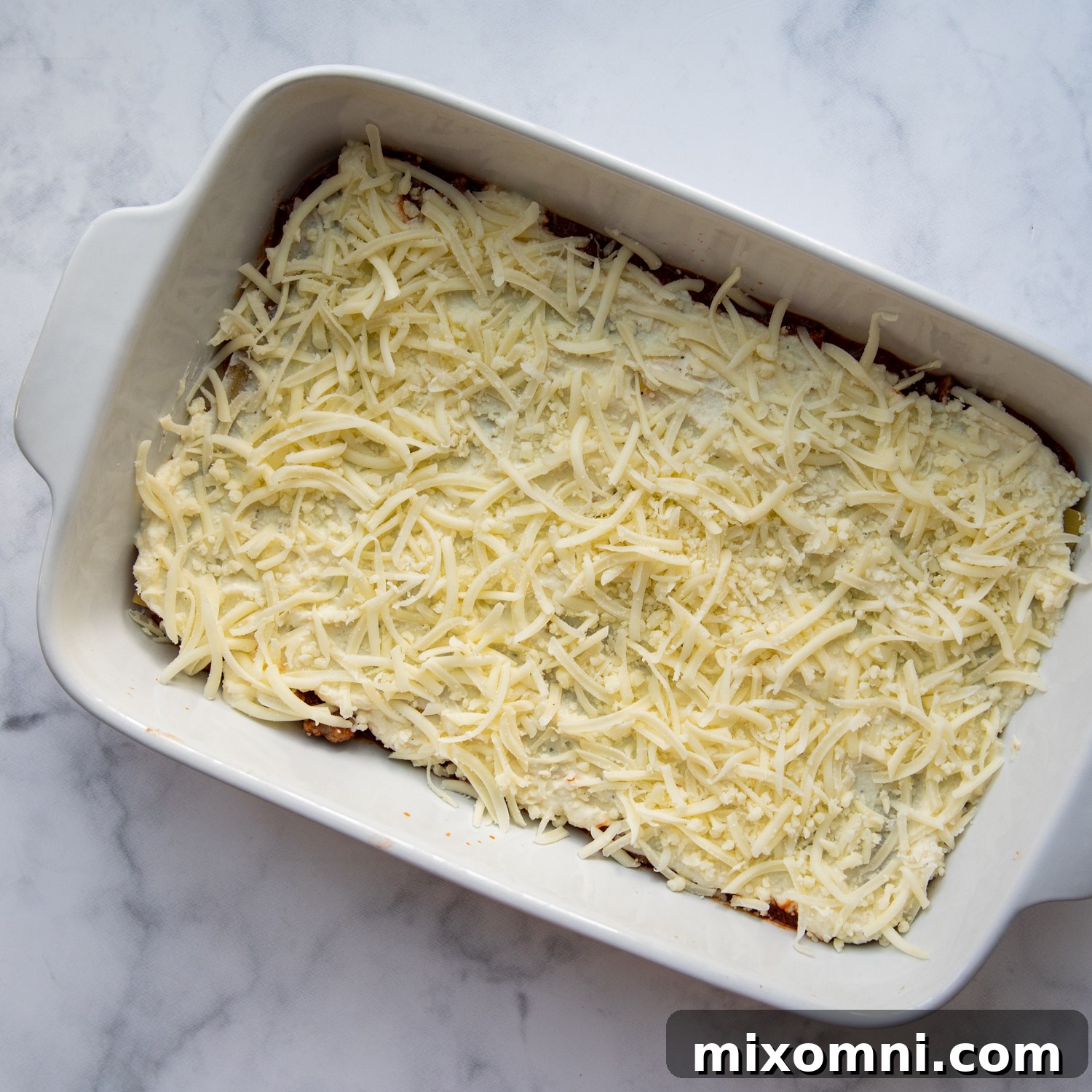 Detailed visual guide showing the process of layering a gluten-free lasagna, from initial sauce to the final cheese topping.