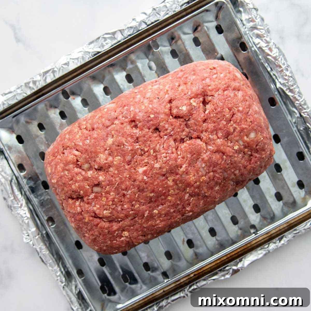 shaped meatloaf on a baking pan.