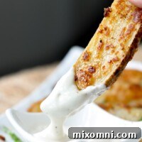 a roasted ranch potato being dipping into ranch dressing