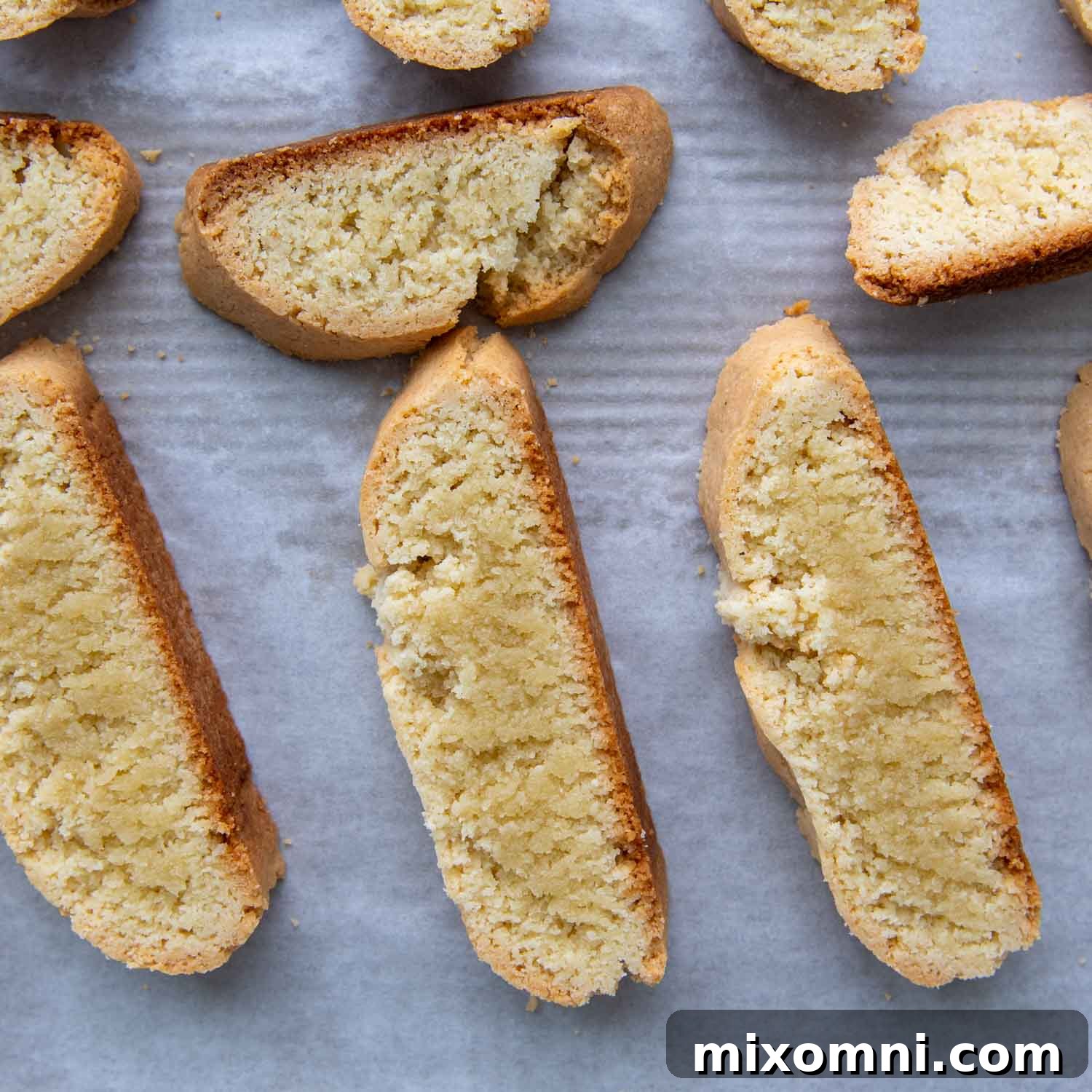 Close-up view of the biscotti slices after the first bake, showing their slightly soft interior before the final toasting.