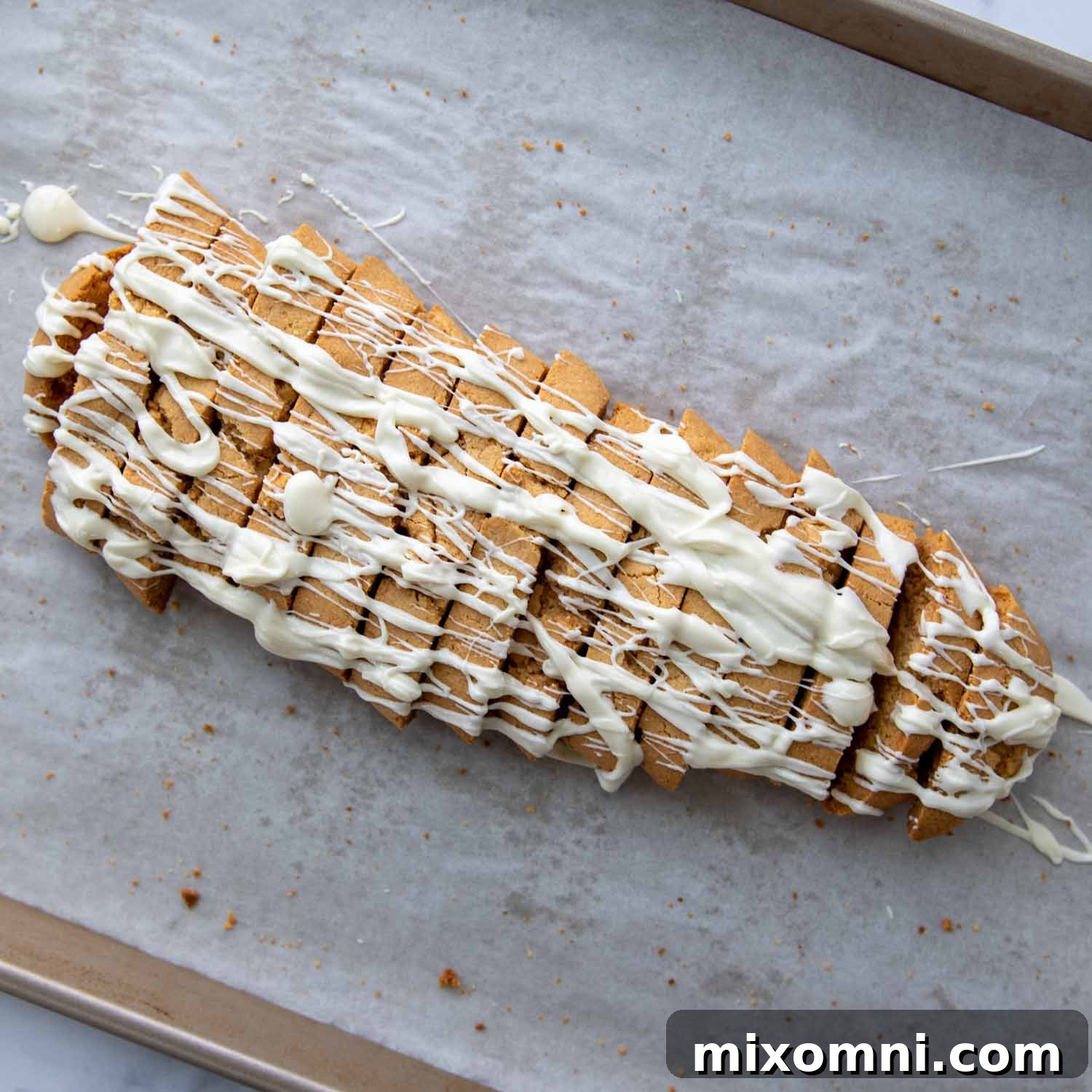 Almond flour biscotti artfully drizzled with white chocolate, showcasing an elegant finish.