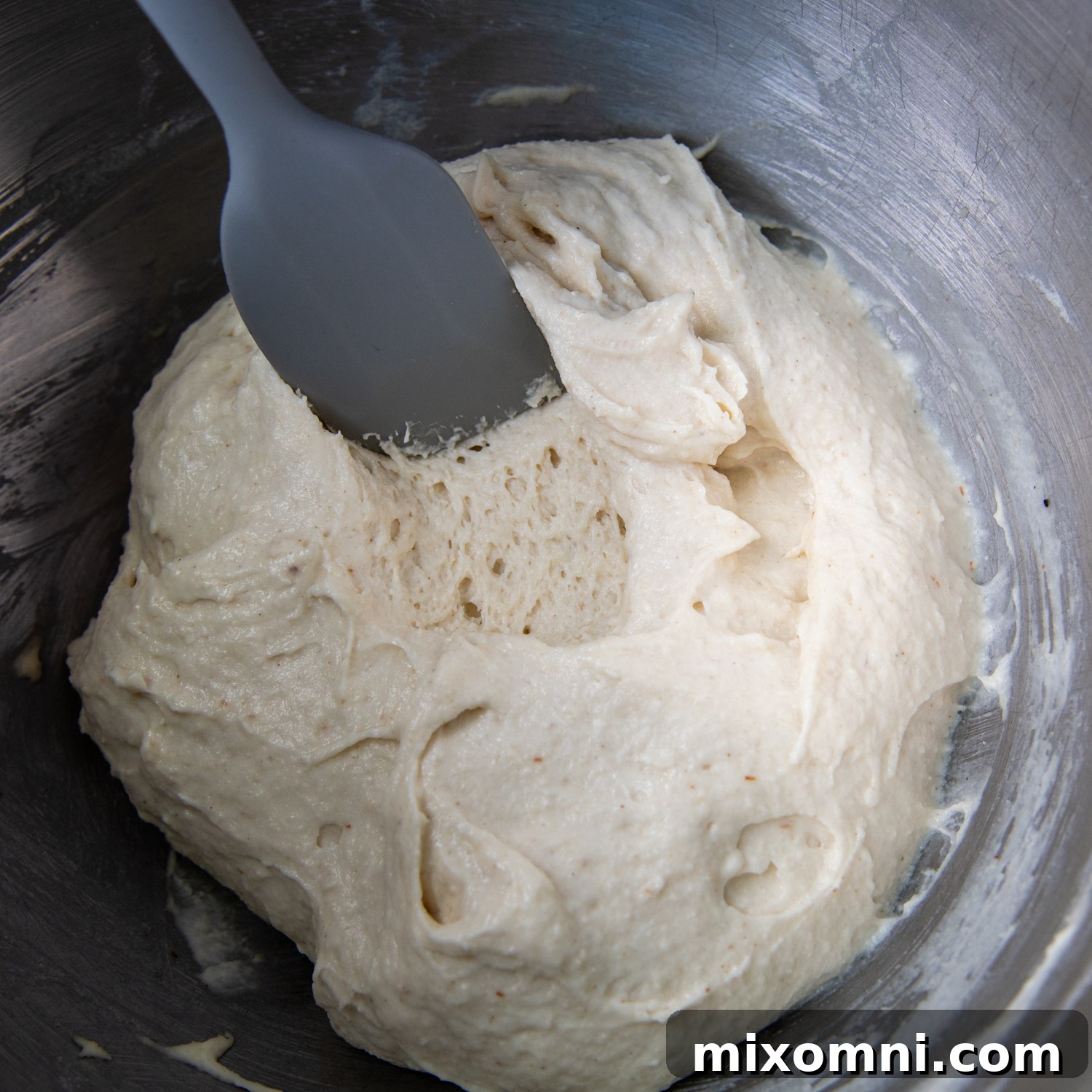a spoon going into the crust to show the texture inside.