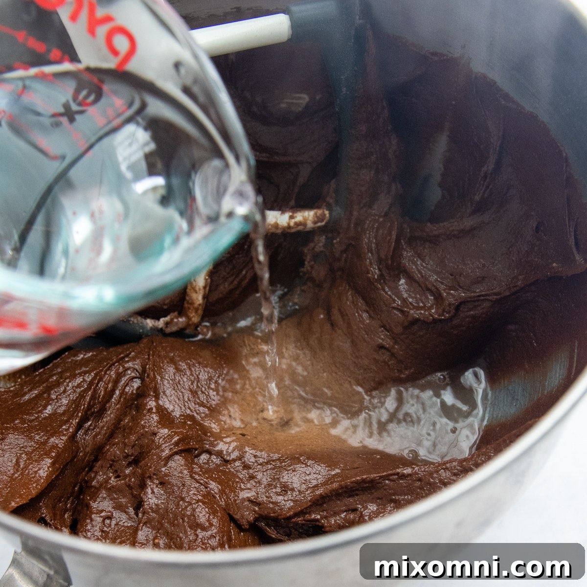 boiling water being poured into a mixing bowl.
