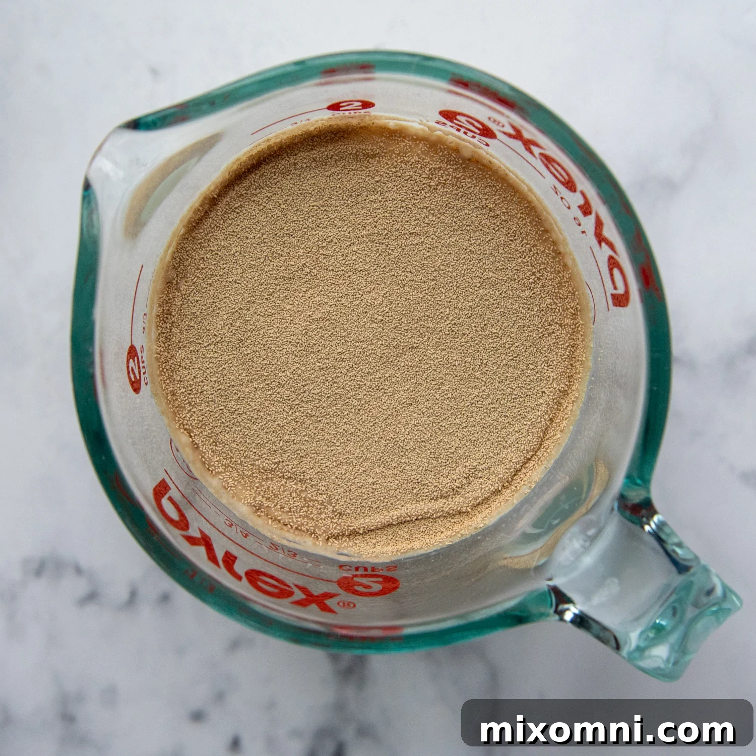 yeast being activated in a measuring cup.