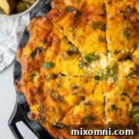 an overhead shot of a whole quiche, cut into slices.