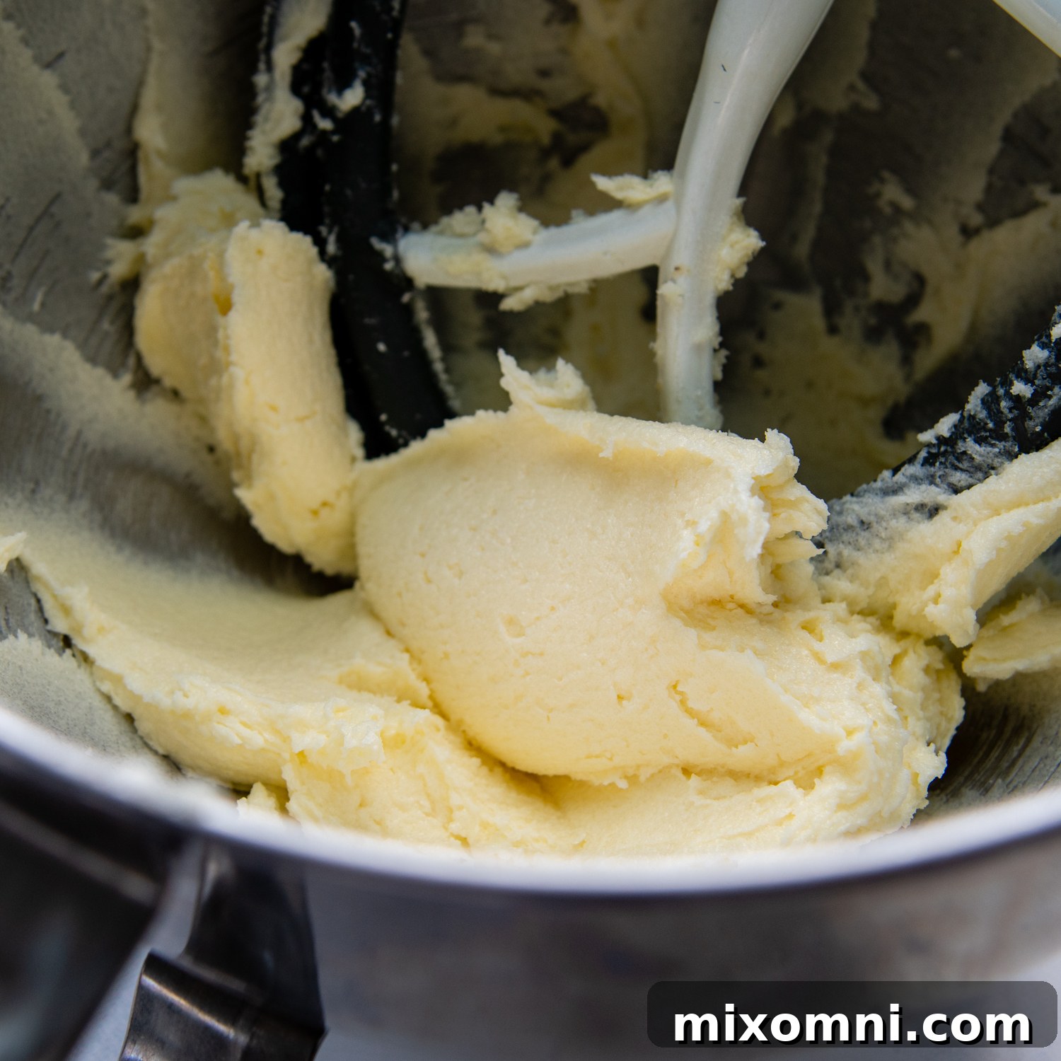 The butter and granulated sugar perfectly creamed together in a mixing bowl, light and fluffy.