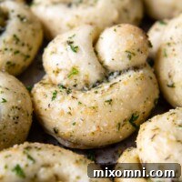 A tantalizing image of golden, soft gluten-free garlic knots, perfectly glazed with savory garlic butter, capturing their irresistible appeal.