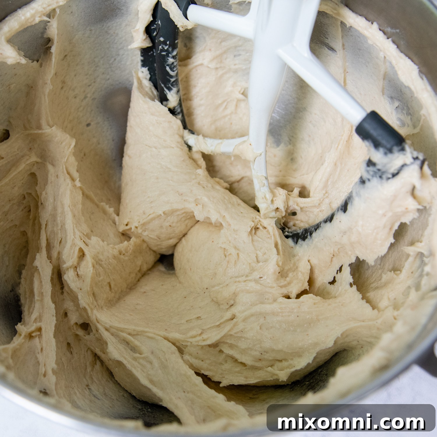 the burger bun dough mixed together in a bowl.