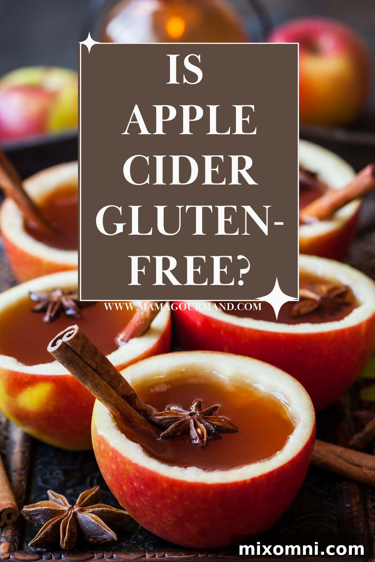 apple cider in cut apples with cinnamon sticks.