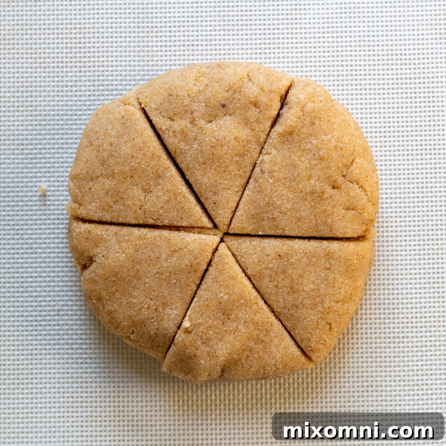 Wet ingredients being mixed into the dry ingredients in a well.