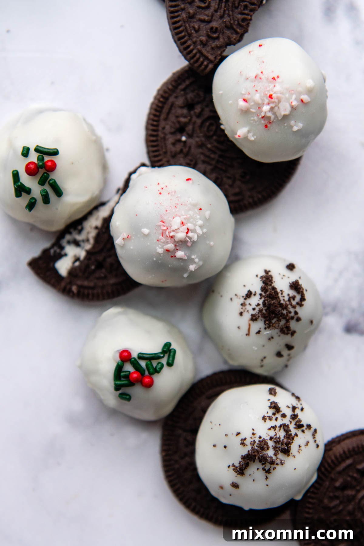 A delightful array of different gluten-free Oreo balls, beautifully decorated with various sprinkles, showcasing their versatility and festive appeal.