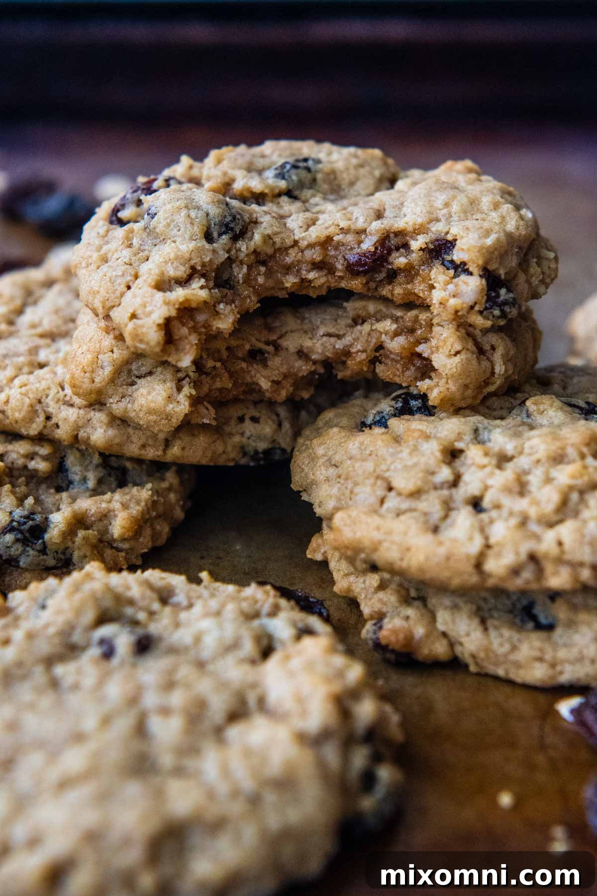 two oatmeal cookies stacked together with bites taken out of them