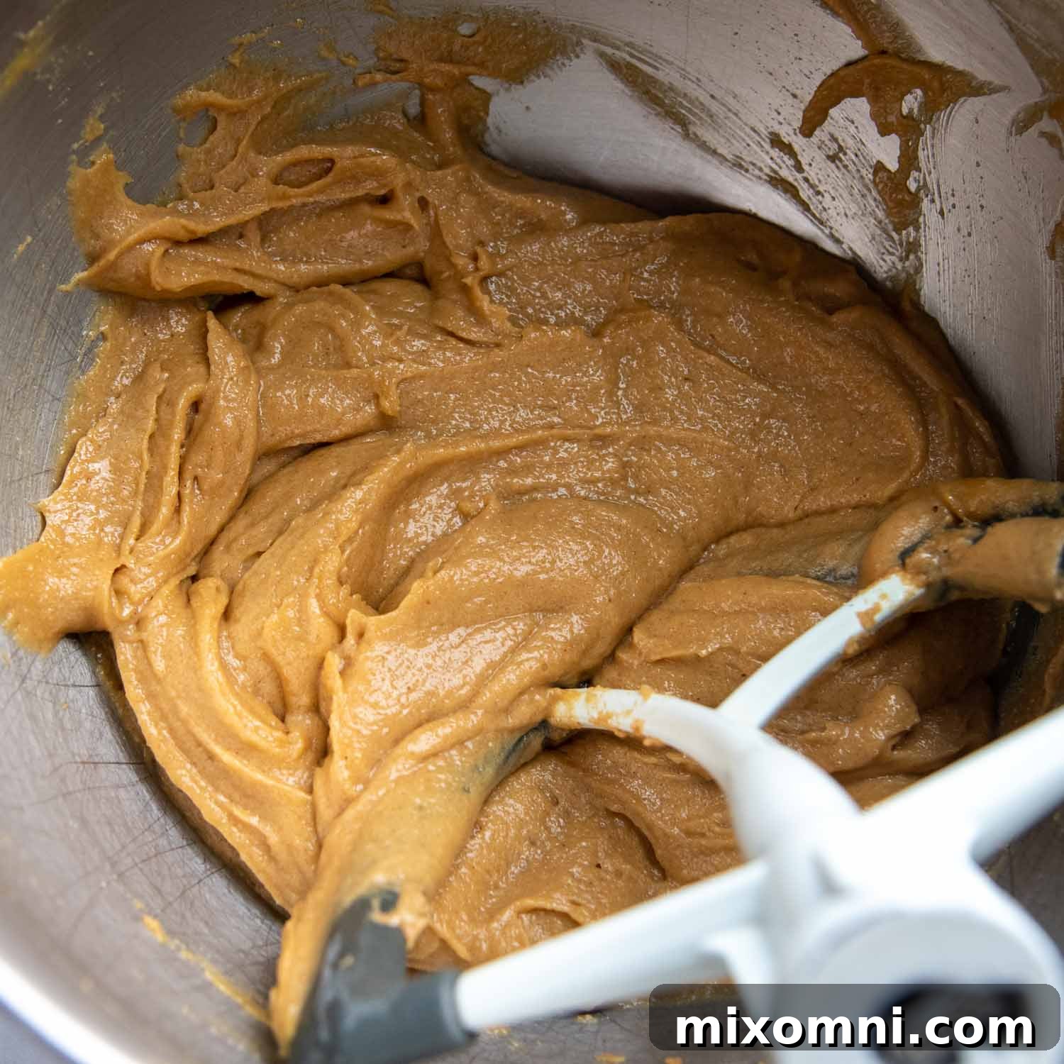 The smooth, creamy dough mixture before adding the gluten-free flour.