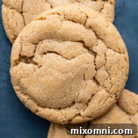 Gluten-free peanut butter cookie on stack of others.