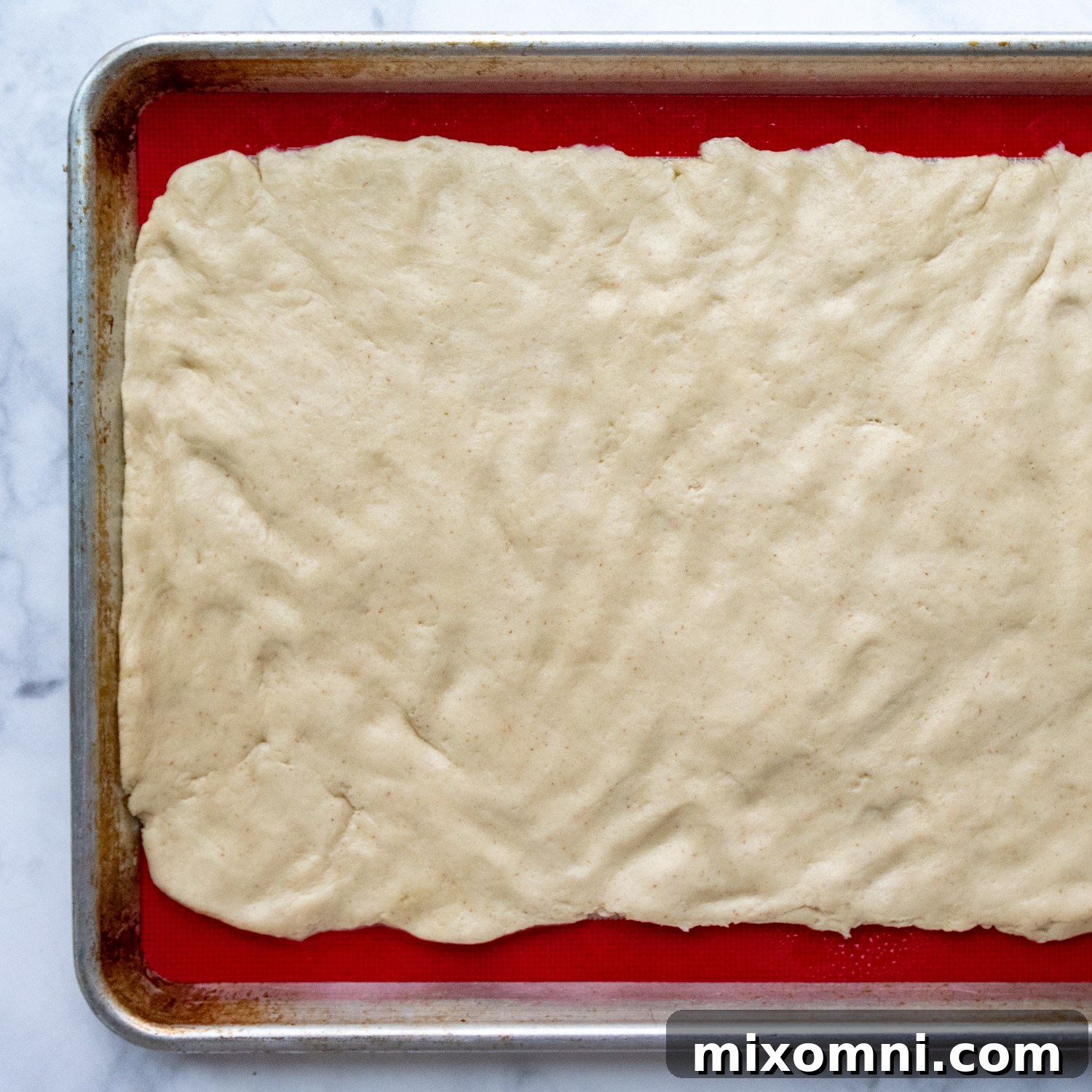 dough patted out into a rectangle.